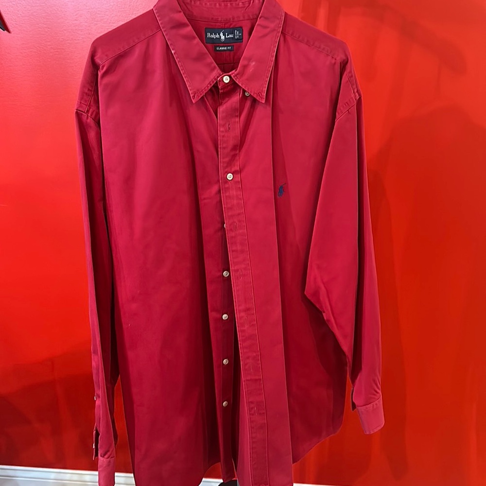 Men’s long sleeve red button-down dress shirt.